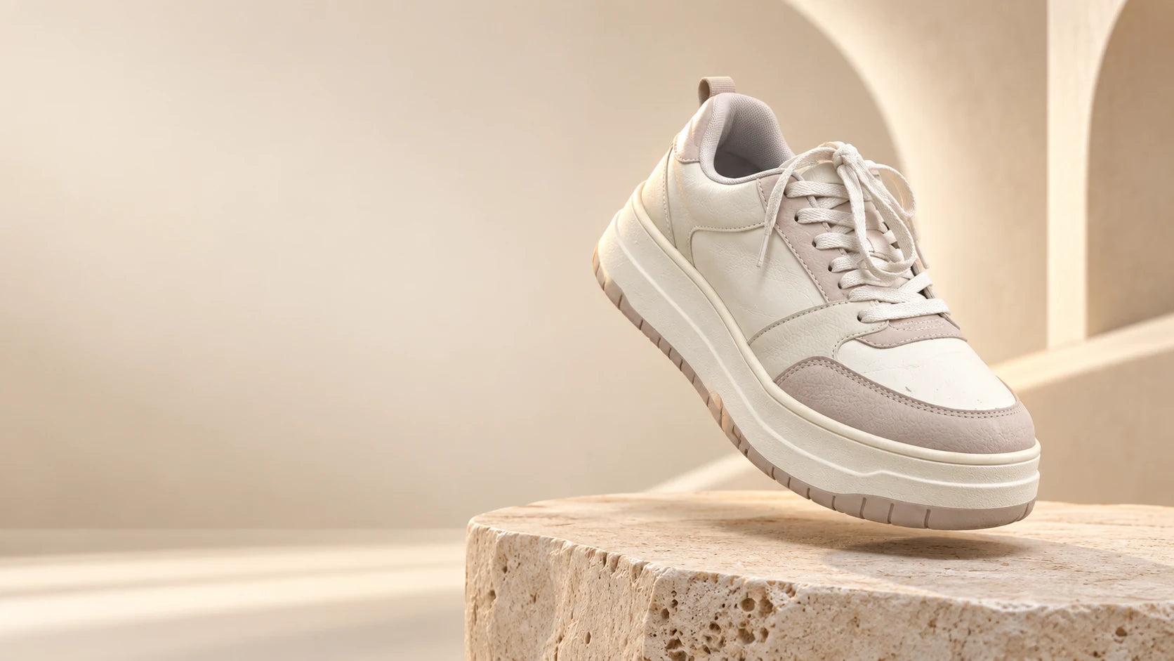 Ivory sneaker in a sculptural studio scene